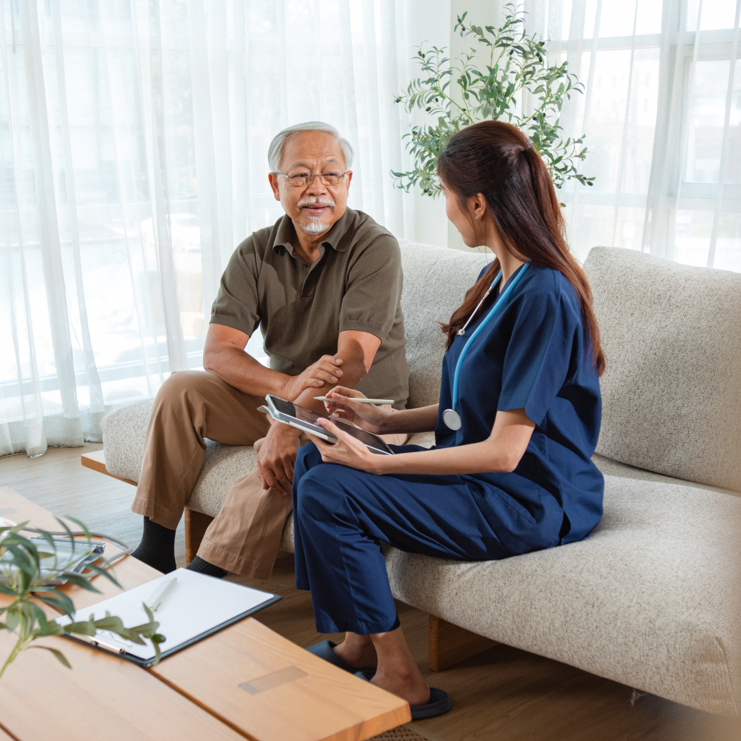Clinician looking at tablet with patient